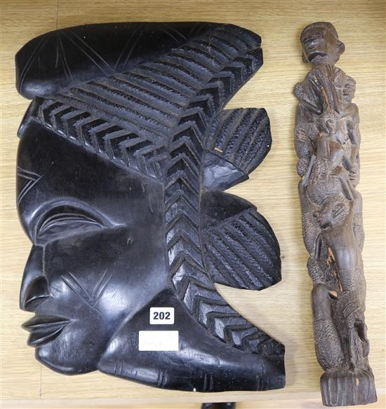An African carved ebony carved face and a figure sculpture 55 & 54cm.
